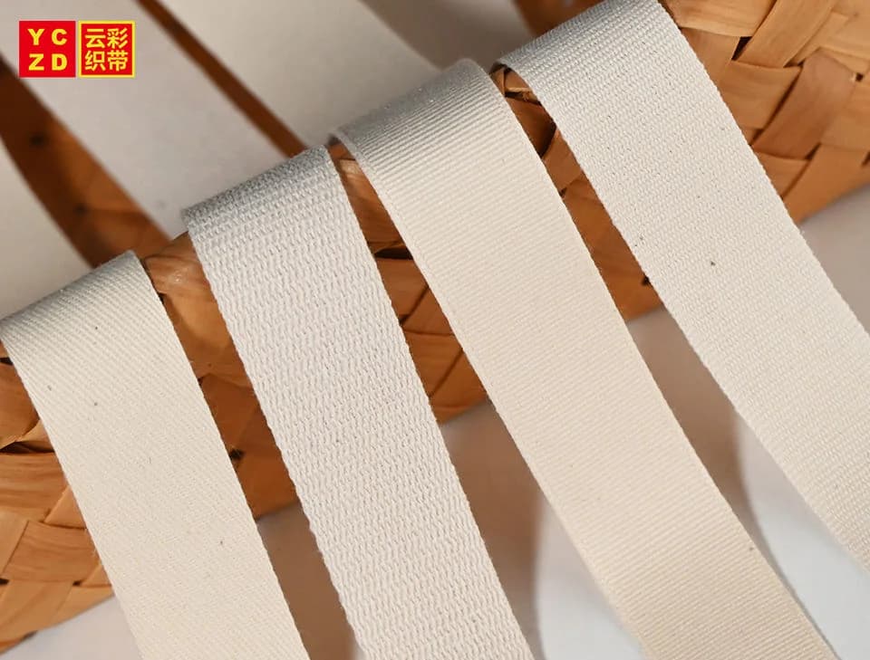 Cream woven straps draped over a woven basket