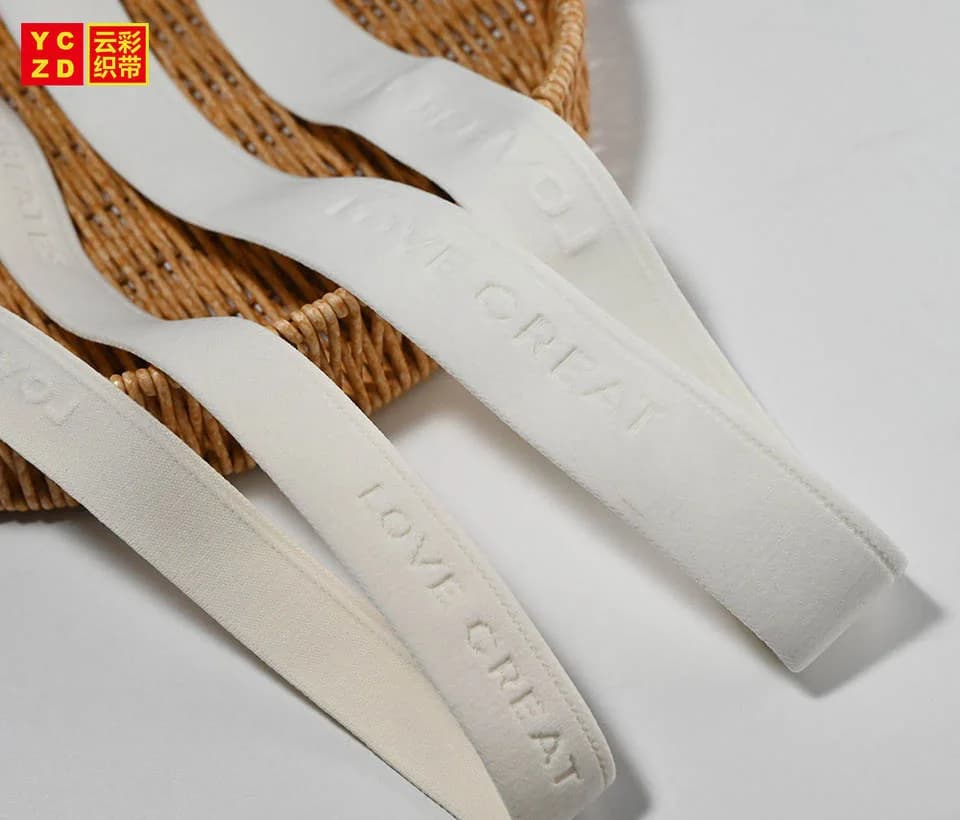 Cream elastic bands draped over a woven basket