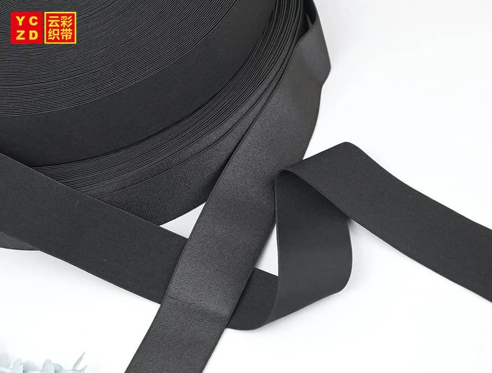 Black elastic tape folded into broad curves