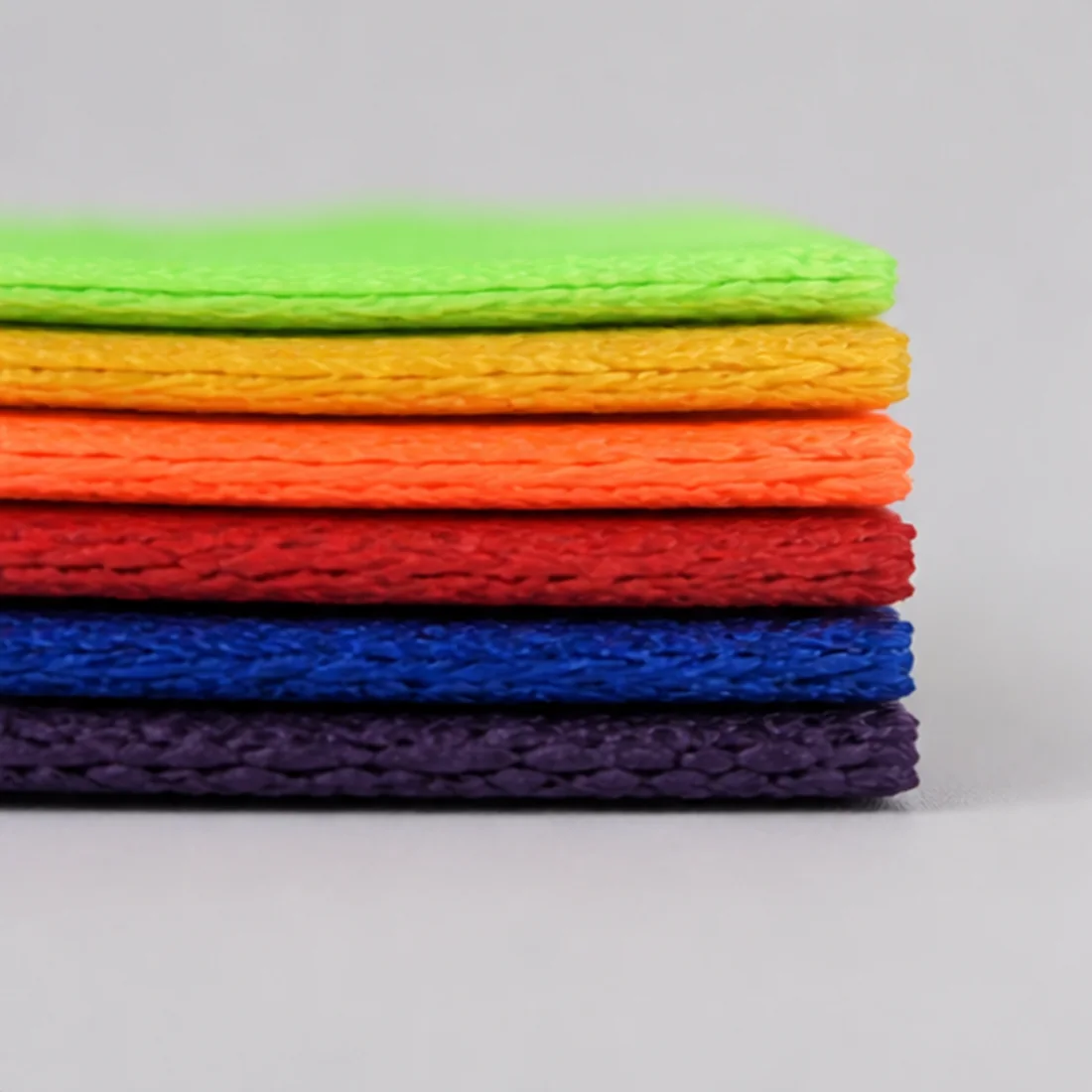 Real stacked woven webbing edges showing thickness and construction differences