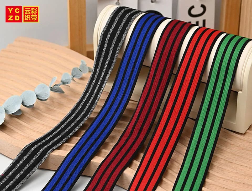 Parallel knitted stripes in black, cream, red, blue and green