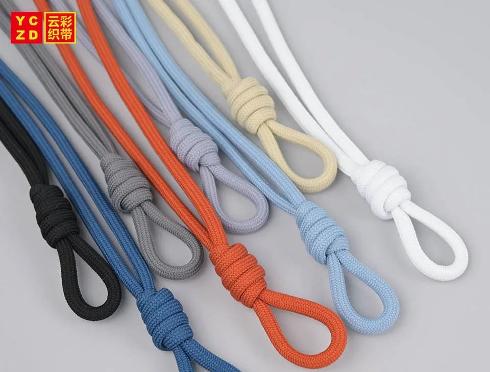 Knotted drawcords in orange, blue, grey, cream and white