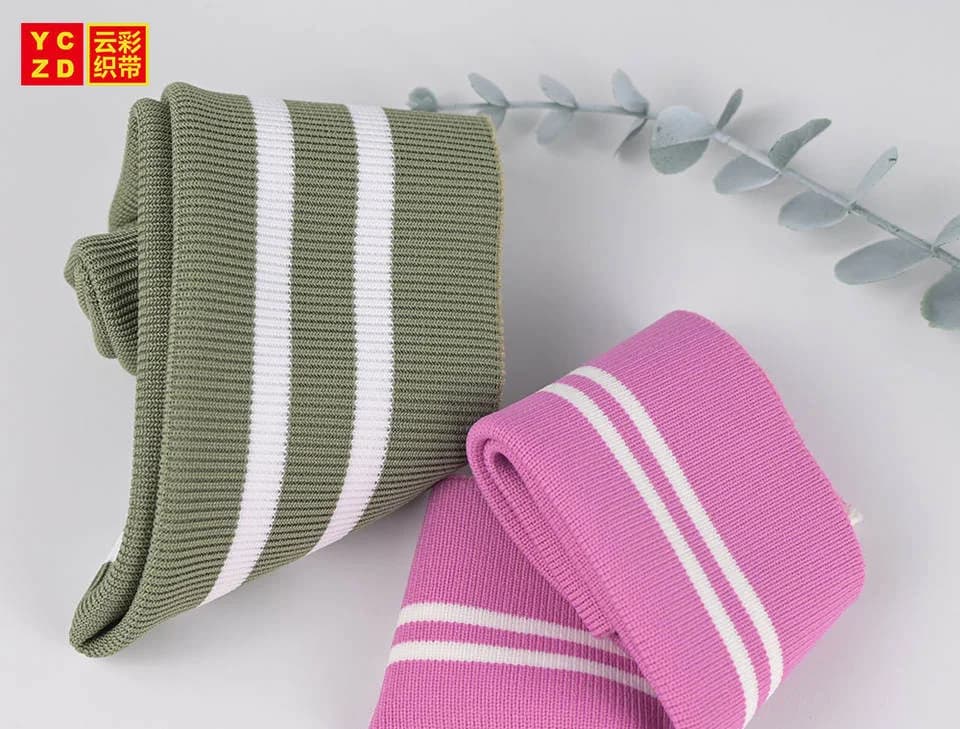 Olive and pink rib-knit trims with pairs of cream stripes
