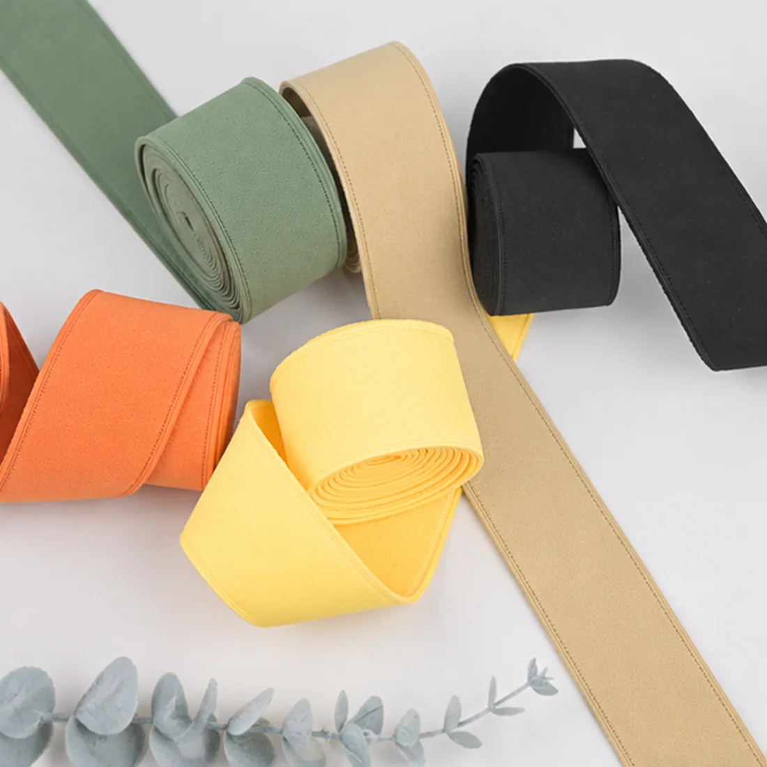 Real elastic bands in several widths and colors arranged for comparison
