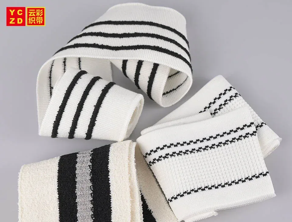 Cream rib-knit bands with black stripes folded into loops