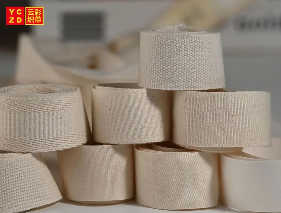 Cream webbing rolls stacked on a table