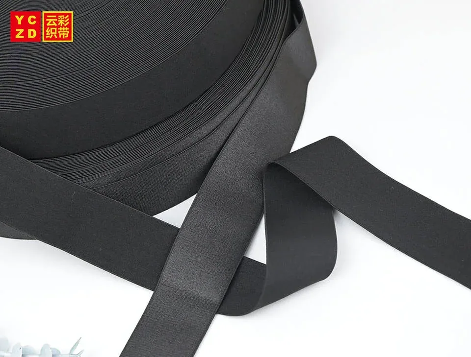 Black elastic tape folded into broad curves