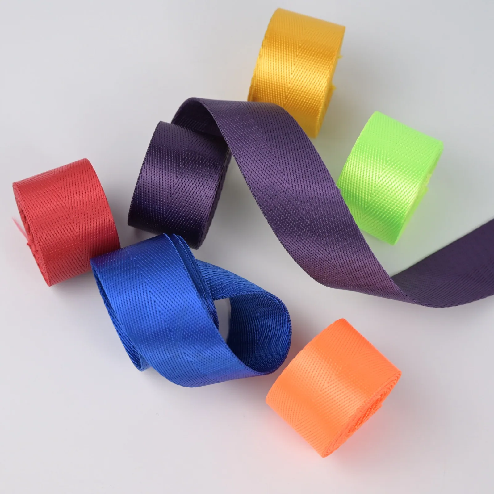 Purple, yellow, green, orange, blue and red tape arranged in loops